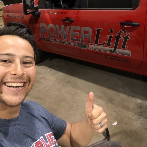 Picture of person in front of a work truck