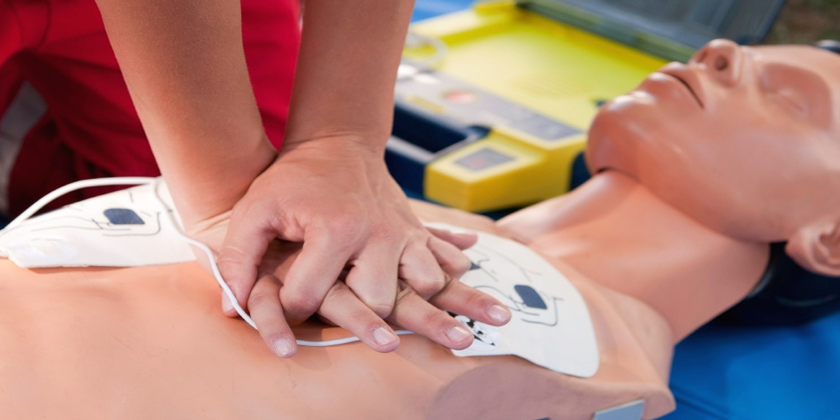 picture of a person performing CPR on a medical dummy
