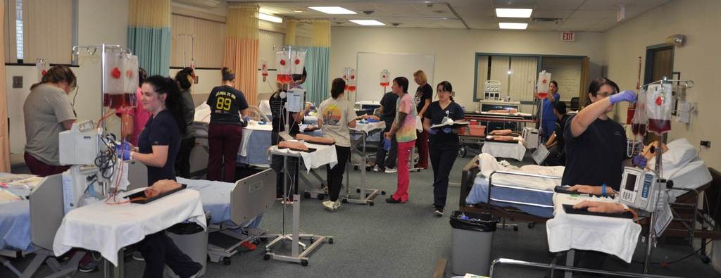 Photo of nursing students in a simulated hospital setting
