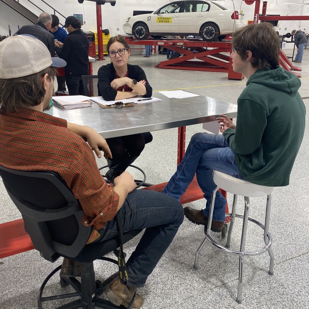 picture of students being interviewed at a table