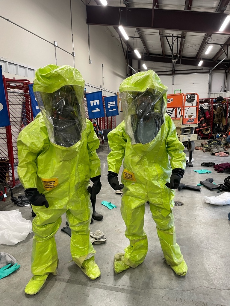 Students wearing PPE equipment for hazardous waste cleanup practice